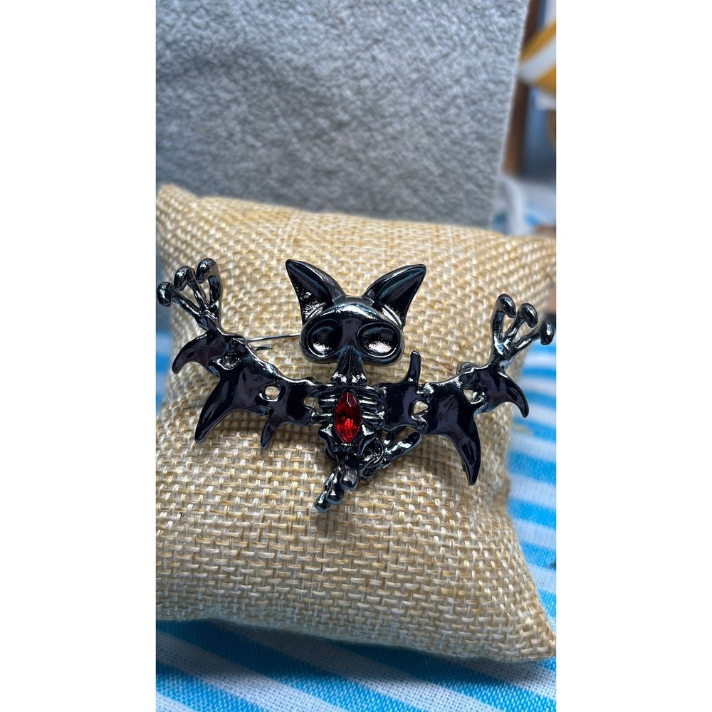 #1. Gothic Skeleton Bat Brooch - Gunmetal Vampire Pin with Red Crystal Accent